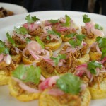 Pulled pork with house made pickled onions and cilantro on sweet potato biscuit
